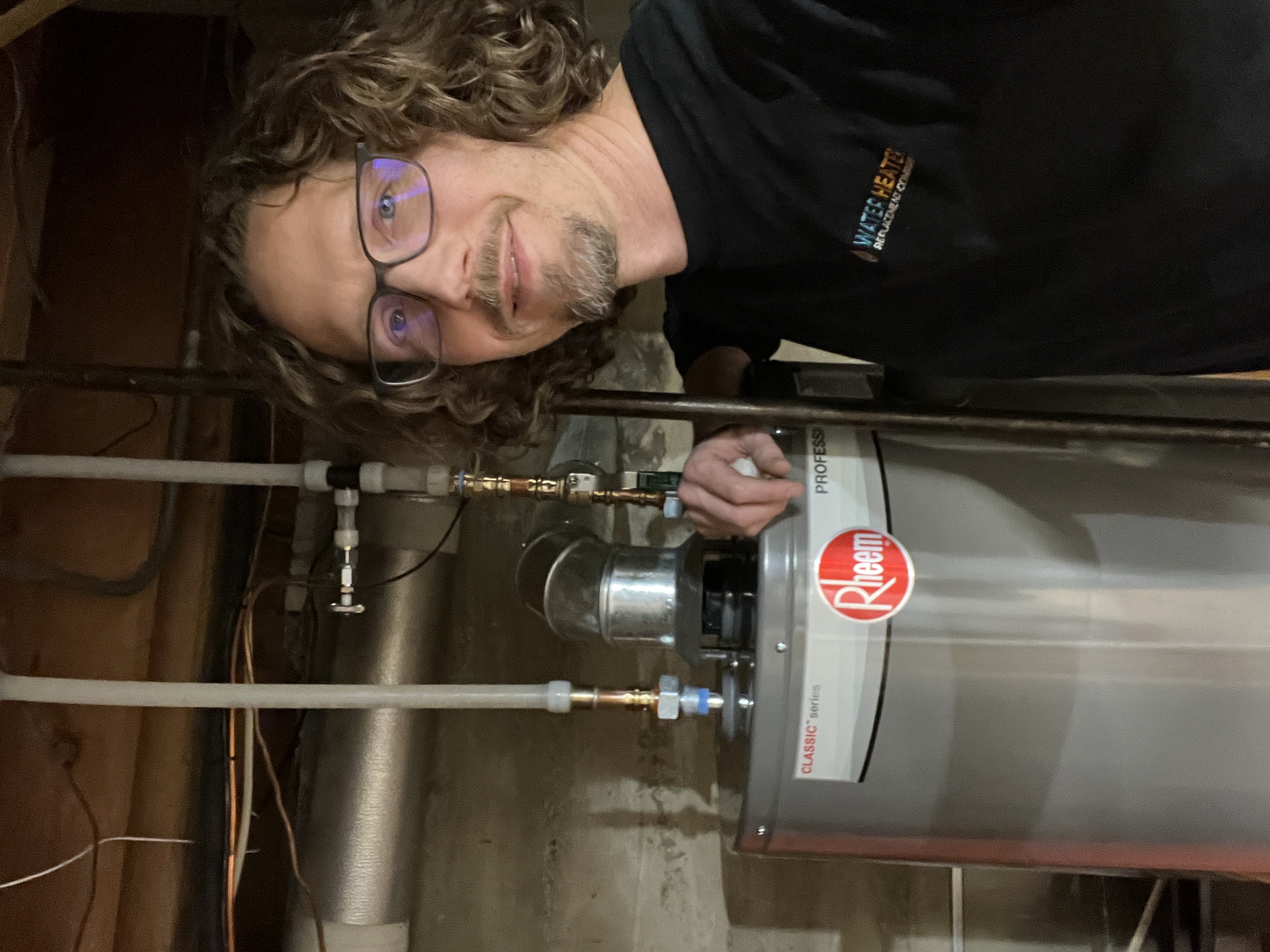 Water Heater Replacement Company technician completing a clean installation